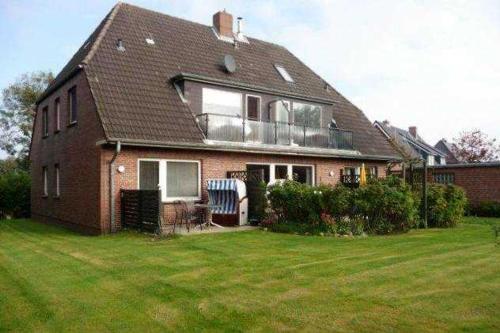 a large brick house with a large yard at Haus Severin Whg Findling EG in Goting