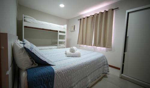 En eller flere senge i et værelse på Apartbuzios - Apartamentos Completos Búzios - 600mt Rua das Pedras