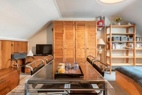 a living room with a couch and a table at Cozy room in residential Alkmaar - Free parking in Alkmaar