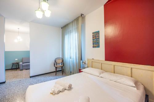 a bedroom with a bed with towels on it at Le stanze in Fiera, Bologna by Short Holidays in Bologna