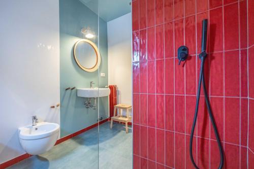 a bathroom with a shower and a toilet and a sink at Le stanze in Fiera, Bologna by Short Holidays in Bologna