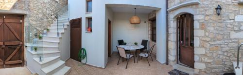 two pictures of a hallway with a table in a building at Casa Leone, whole house with private pool! in Atsipopoulo