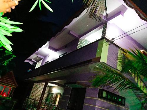 a tall building with a light on top of it at Anna Miracle Homestay in Kāsarkod