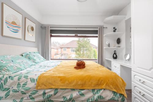 a bedroom with a bed with a teddy bear on it at Manchester Business and Leisure Home with Free Parking in Manchester