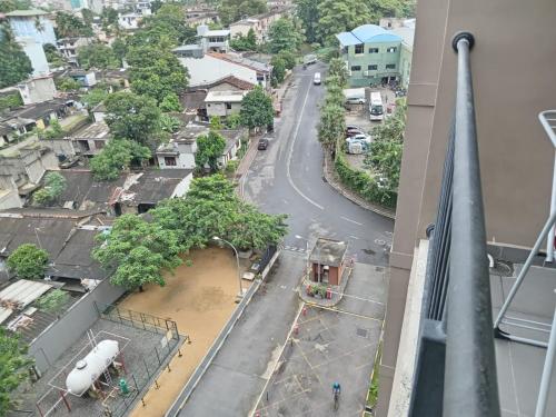 arial view of a city with a street and a building at Oval View Residencies, Colombo 08 in Yakbedda