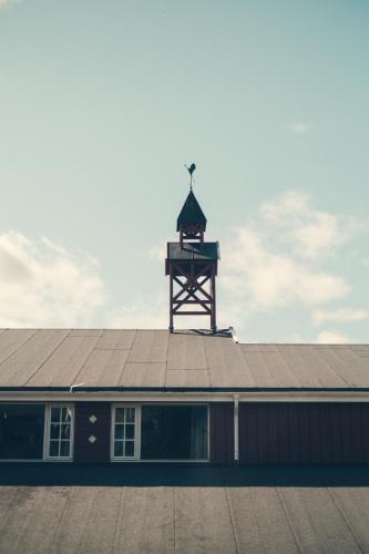 a building with a clock tower on top of it at Gålå Høgfjellshotell in Gålå