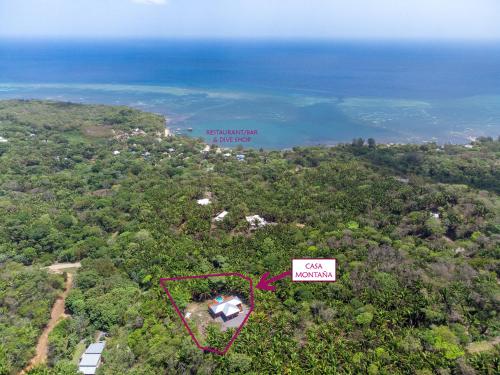 an aerial view of an island with the ocean at Mountain House Palmetto Bay with Private Pool in Roatan
