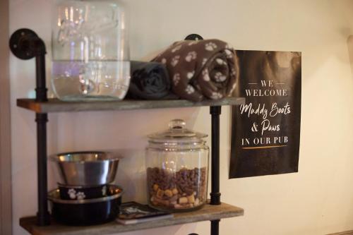 a shelf with a jar of food and a sign at The Coleshill by Greene King Inns in Coleshill