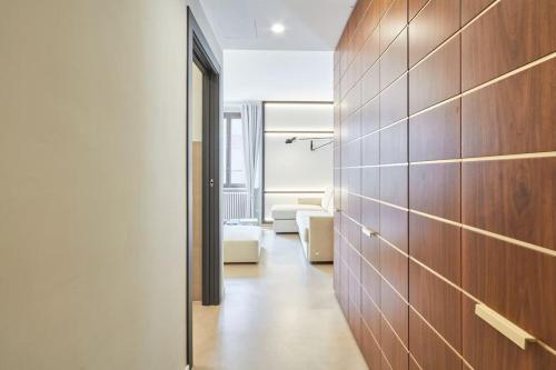 a hallway with a living room with a couch at Easylife - Milano - Tadino 13 - Porta Venezia in Milan