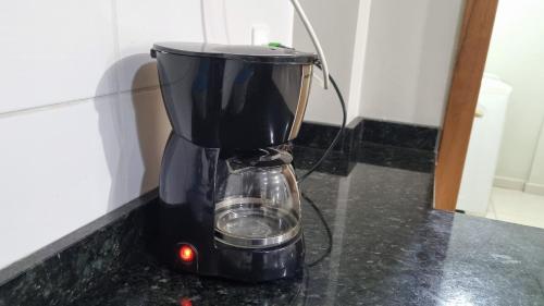 a black blender sitting on top of a counter at Ed Bella Italia in Toledo