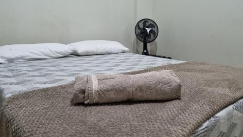 a bed with a towel on top of it at Ed Bella Italia in Toledo
