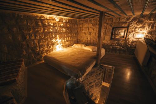 Katil atau katil-katil dalam bilik di Saliche Cave Suite