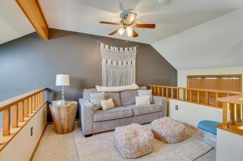 a living room with a couch and a ceiling fan at Indoor Pool Access and Deck Galena Family Getaway! in Galena