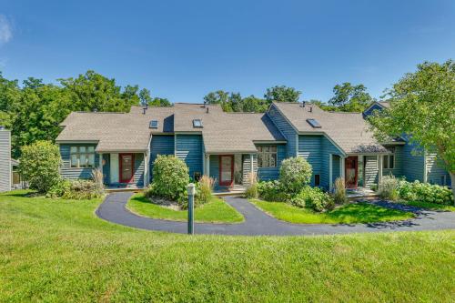 a house with a blue house with a driveway at Indoor Pool Access and Deck Galena Family Getaway! in Galena