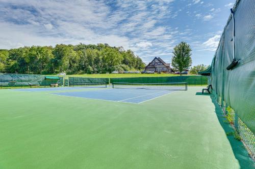 a tennis court with a tennis racket on it at Indoor Pool Access and Deck Galena Family Getaway! in Galena