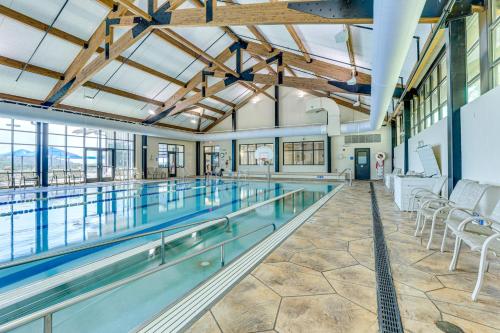 a large swimming pool with chairs and tables at Indoor Pool Access and Deck Galena Family Getaway! in Galena