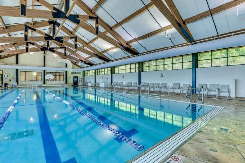 a large swimming pool with a large ceiling at Indoor Pool Access and Deck Galena Family Getaway! in Galena