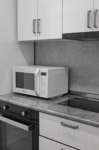 a microwave oven sitting on a counter in a kitchen at Best Builder in Tbilisi City