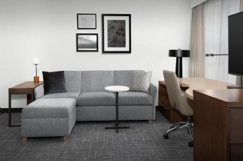 a living room with a couch and a table at Residence Inn Bozeman in Bozeman