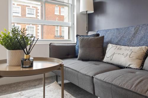 a living room with a couch and a table at WhiskAwayStays - Foregate Street - Apartment 4 in Worcester