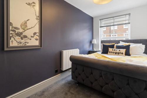a bedroom with a large bed and a window at WhiskAwayStays - Foregate Street - Apartment 4 in Worcester