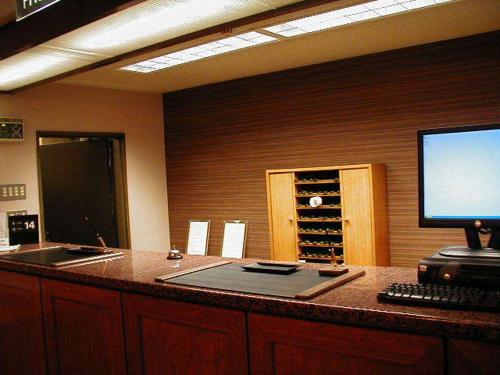 an office with a desk with a computer on it at Hotel Takamatsu Hills in Takamatsu