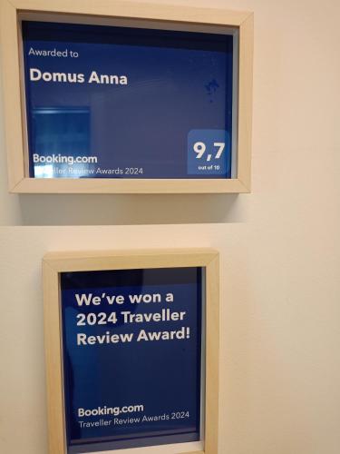 a sign that says were won a traveller review award at Domus Anna in Montegrotto Terme
