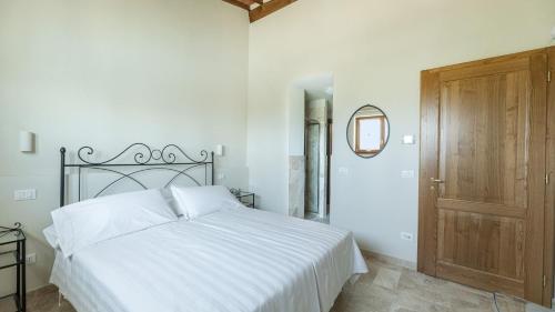 Ένα ή περισσότερα κρεβάτια σε δωμάτιο στο Villa Vinsantaia