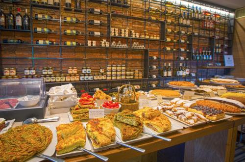 a display case in a store with many different types of food at Podere del Priorato in Albinia