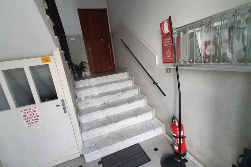 a fire hydrant is standing next to a stairway at Via Vernazza 30 mt dal mare in Cogoleto
