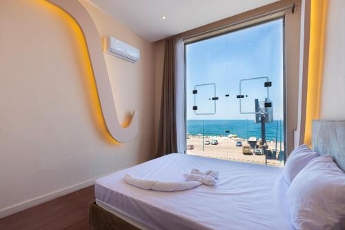 Ένα ή περισσότερα κρεβάτια σε δωμάτιο στο Hyat Suites & Rooms