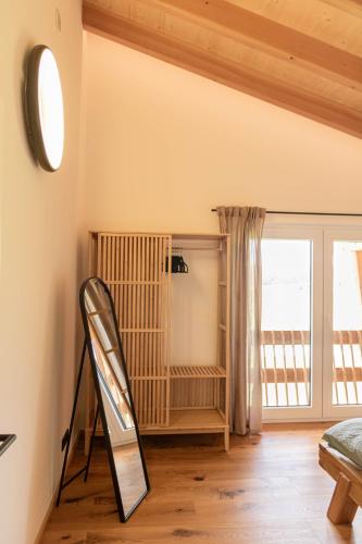 a room with a ladder next to a window at Schwarzwald Chalet Auwald in Freiamt