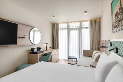 Кровать или кровати в номере Hilton Garden Inn Debrecen City Center