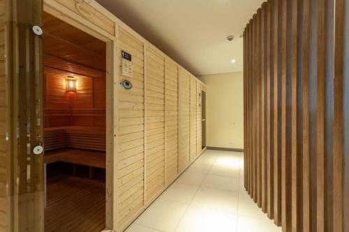 an empty hallway with a sauna in a house at Tree of Life Penthouse 3BR w Gym Pool Sauna More in Manila