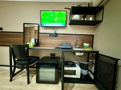 Μια τηλεόραση ή/και κέντρο ψυχαγωγίας στο Aram Kerasi Rooms