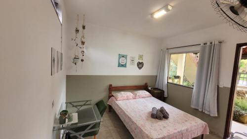 Un ou plusieurs lits dans un hébergement de l'établissement Hospedagem Cachoeira do Tabuleiro