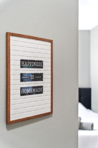 a picture of a sign on a wall at The Dreamy Getaway House in Spring in Spring