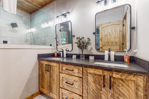 a bathroom with a sink and a mirror at Rustic Elegance of Ellijay in Ellijay