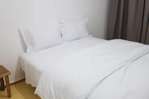 Cama ou camas em um quarto em Appartement Panoramique Uniquement les familles