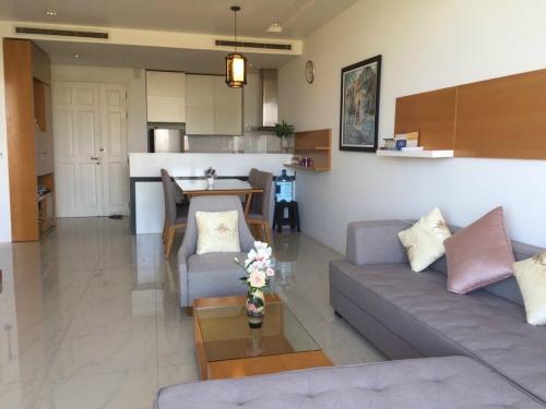 a living room with a couch and a table at Hotel,Căn Hộ Mũi Né Sea link in Phan Thiet