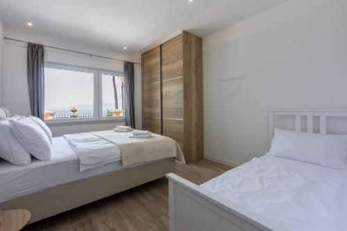 En eller flere senge i et værelse på Palace Paulina 1B