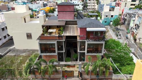 a building with a tower on top of it at Villa Ecotiva in Puducherry