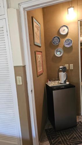 a room with a table and plates on the wall at Sweet Dreams in San Carlos