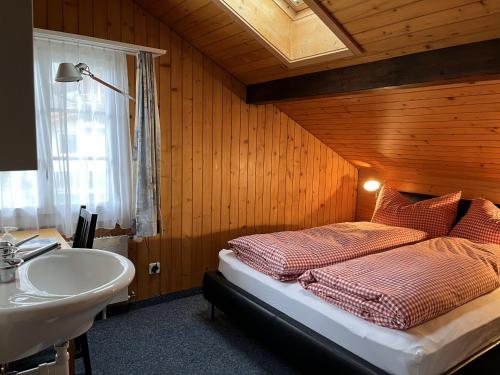 Postel nebo postele na pokoji v ubytování Guesthouse Sonnegg