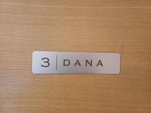 a sign that says darma on a wooden door at 4 TeTE in Vrhpolje