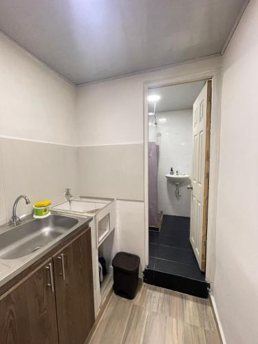 a small bathroom with a sink and a sink at Apartaestudio #3 in El Boquerón