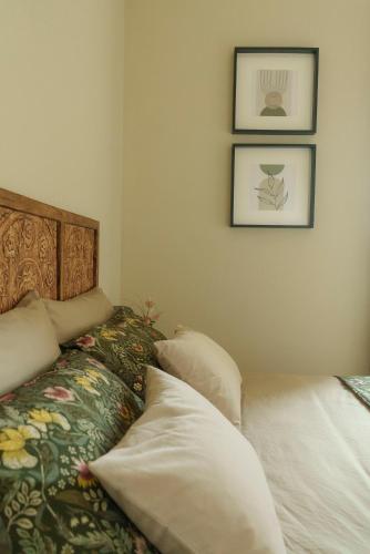 a bedroom with a bed and two pillows at Relais di campagna la polledrara in Paliano