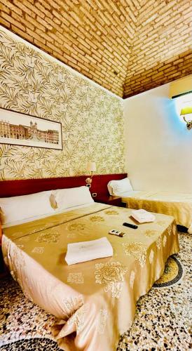 Katil atau katil-katil dalam bilik di Rome central station guest house