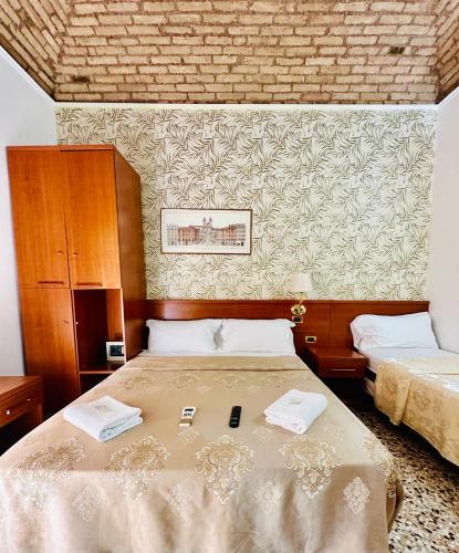 Katil atau katil-katil dalam bilik di Rome central station guest house
