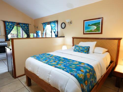 a bedroom with a large bed in a room at West Bay Lodge and Spa in West Bay